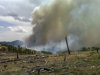 This Tuesday June 5, 2022 photo provided by the Wyoming State Forestry Division shows smoke rising from a wildfire burning in a rugged area of the Medicine Bow in southeast Wyoming. The fire, which is believed to have been started by lightning on Sunday night, has burned about 3,500 acres about 20 miles northwest of Wheatland. About 120 firefighters, aided by helicopters and air tankers, are on the scene with more crews expected Wednesday. (AP Photo/Wyoming State Forestry Division)