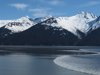 The biggest bore tide of the summer roared into Turnagain Arm south of Anchorage, Alaska, on Tuesday, June 5, 2012. Here a kayaker awaits the bore tide to ride it. Bore tides can happen all over the world, but Anchorage's Turnagain Arm and Knik Arms are the only places in the United States where they occur regularly, according to Michael Lawson a meteorologist with the National Weather Service in Anchorage.  (AP Photo/Ron Barta)